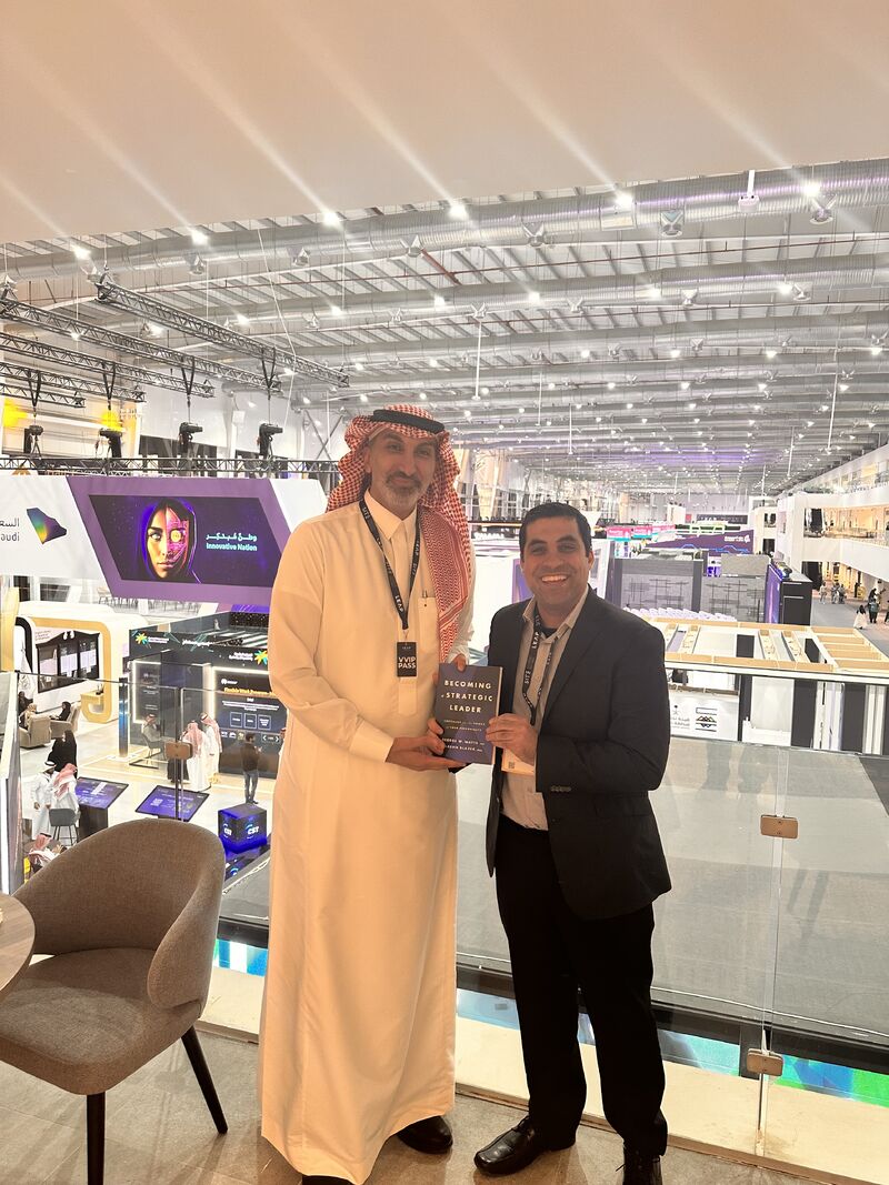 Robbie Abed holding Becoming a Strategic Leader